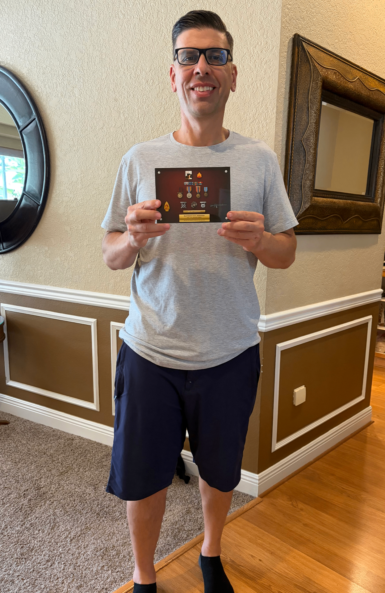 A veteran holding his finished Valor Block™ at home